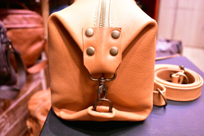 The Convertible Carrot-Colored Dopp Kit Crossbody Bag