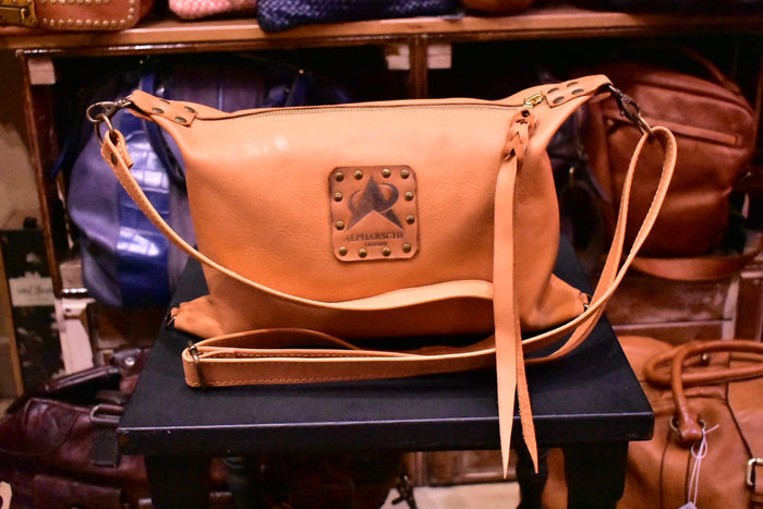 The Convertible Carrot-Colored Dopp Kit Crossbody Bag